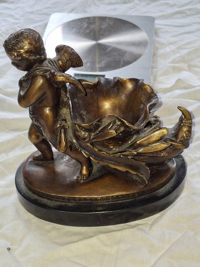 Bronzed Winged Cherub putto open seashell or leaf-shaped vessel with a scorpion like tail.