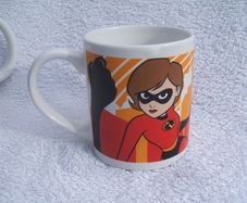THE INCREDIBLES (Disney/Pixar) - a child's ceramic mug featuring Mr. Incredible and Elastigirl (c.2004)