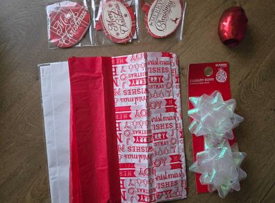 Christmas tissue paper, ribbon, bows and gift tags