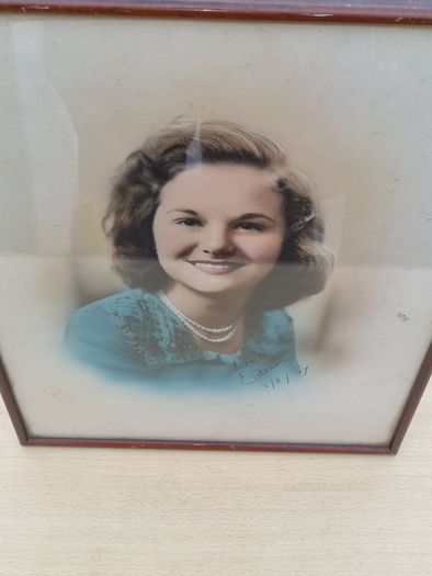 Archival, hand-colored portrait of a woman