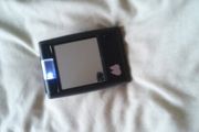 compact mirror with light , would fit in handbag .