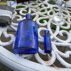 two colbolt blue bottles
