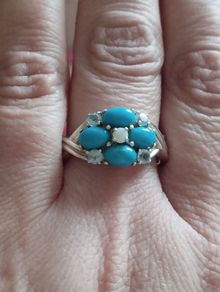 A 925 sterling silver ring with turquoise, opal, and topaz.