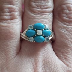 A 925 sterling silver ring with turquoise, opal, and topaz.
