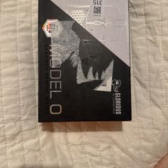Glorious Model O wired gaming mouse in sealed packaging