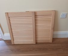 a pair of louvre doors for cabnet