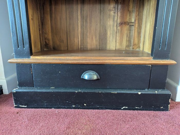 Tall black and wood colour bookcase