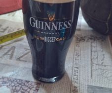 Bar Advertisement Classic Branded Guinness Pint Glass filled with a Displayed Pint of Guinness Draught, Postage Available or Collection