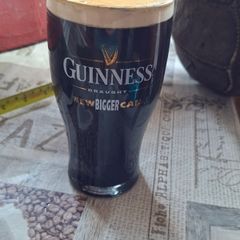 Bar Advertisement Classic Branded Guinness Pint Glass filled with a Displayed Pint of Guinness Draught, Postage Available or Collection