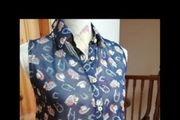 Ladies Lustre Top,  decorated with cowboy hats and horseshoes. new with tags.