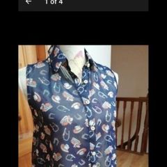 Ladies Lustre Top,  decorated with cowboy hats and horseshoes. new with tags.