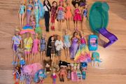 Large set of Barbie dolls.