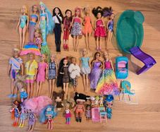 Large set of Barbie dolls.