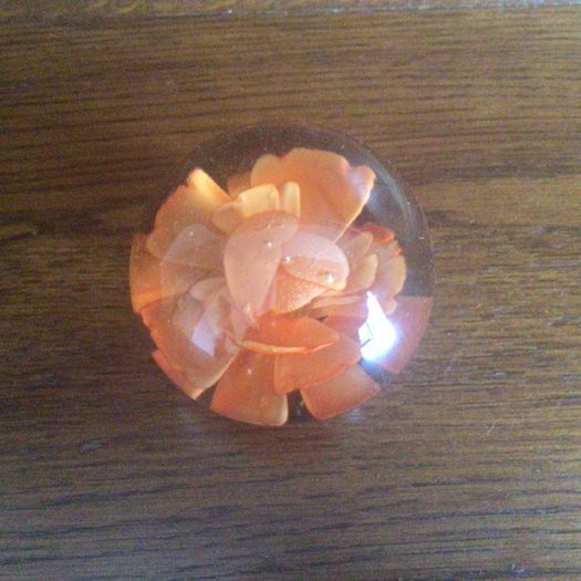 A pair of floral clear glass paperweights