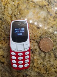 Miniature Mobile Phone The Tiniest Mobile in the World.
