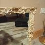 Rococo style wall mirror features a heavy, ornate resin frame decorated with carved cherubs and floral motifs Image 4