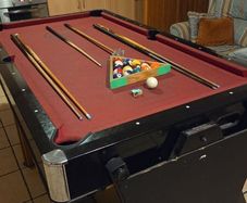 Pool table. (Flips to air hockey table)