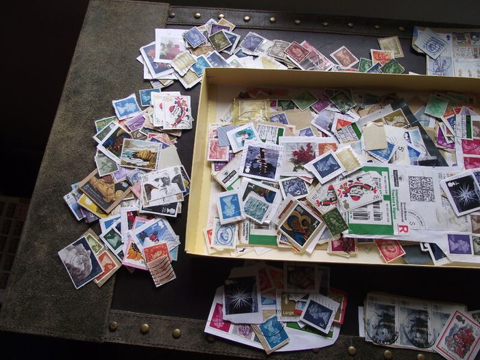 A box with collection of stamps from Great Britain