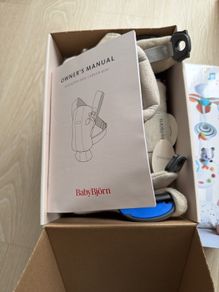 babybjorn baby carrier mini & tiny love cot musical entertainment