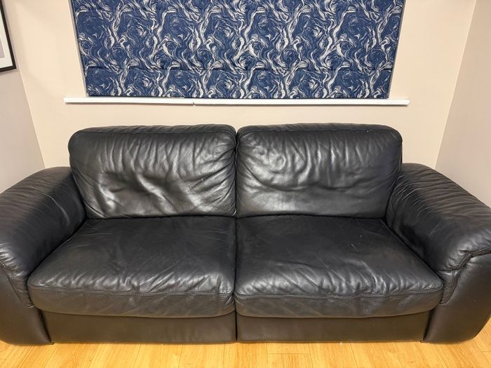 Black leather Natuzzi sofa and two chairs