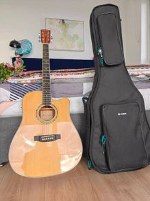 Acoustic guitar with cover