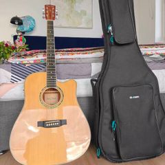Acoustic guitar with cover