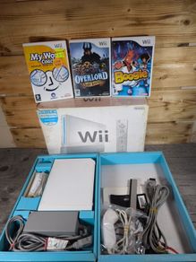 nintendo wii boxed with 3 games .