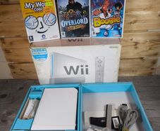 nintendo wii boxed with 3 games .