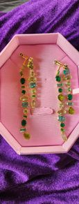 Swarovski asymmetrical drop green crystal earrings