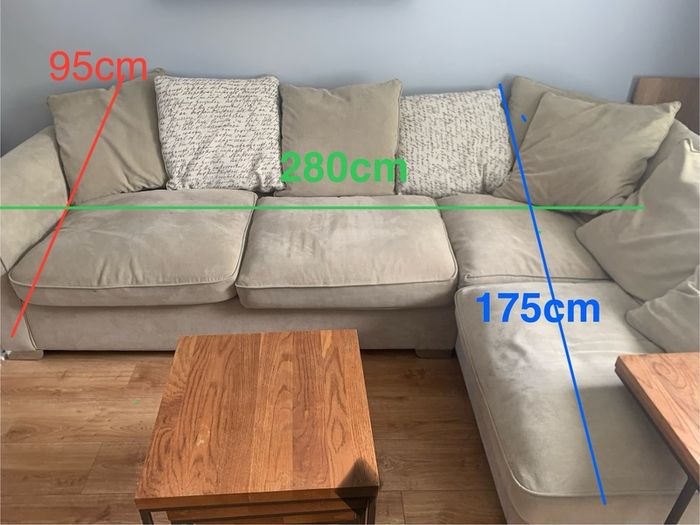 Corner sofa with footstool