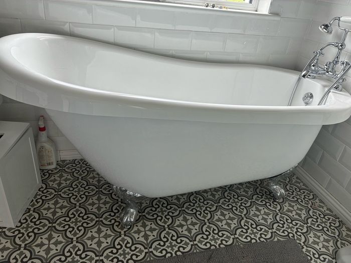 free standing bath with taps and and hose