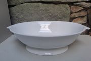 Oval white serving dish with stand