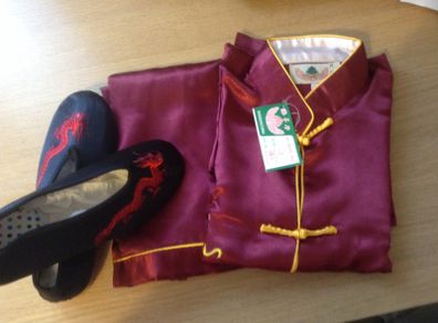 A full set of dark ruby red Chinese Kung Fu Costume with matching black shoes, with tag for boys.