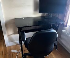 Office desk with rolling chair
