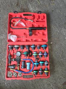 Coolant pressure tester and vacuum bleeder