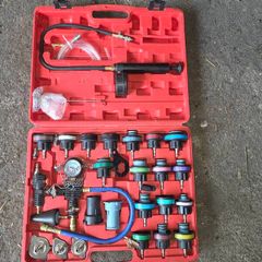 Coolant pressure tester and vacuum bleeder
