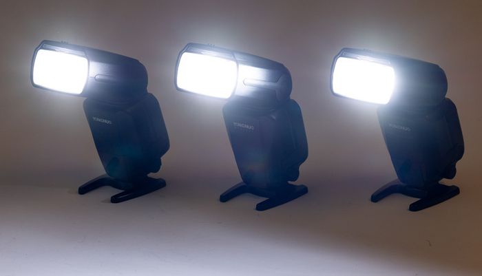 Three Yongnuo YN600EX-RT II flashguns with bag and accessories