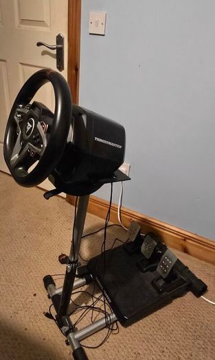Thrustmaster T248 Racing Wheel and T3PM Pedal Set, complete with a sturdy folding metal wheel stand.