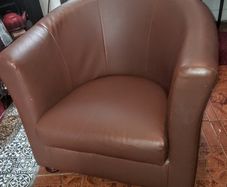 Modern tub armchair braun faux leather on turned wood legs