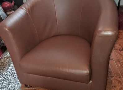 Modern tub armchair braun faux leather on turned wood legs