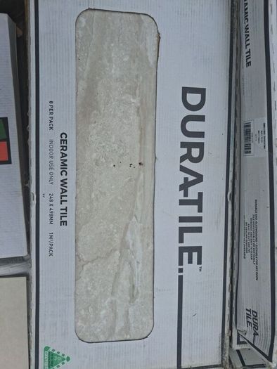 Enough for a small bathroom  wall and floor tiles. Cost 950 new  job cancelled will take 200
