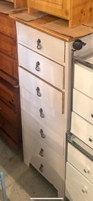 Tall white chest of drawers with oak top