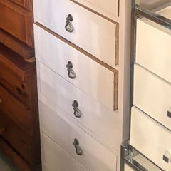 Tall white chest of drawers with oak top