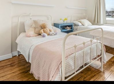 Cream metal single bed