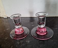 Pair of pink glass candleholders