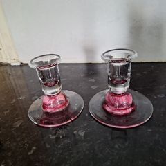 Pair of pink glass candleholders