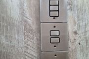 chrome electrical swithes and a single socket plate