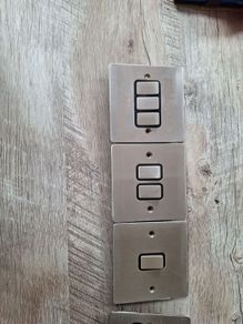 chrome electrical swithes and a single socket plate