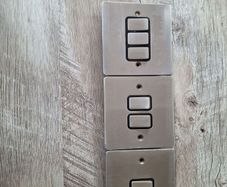 chrome electrical swithes and a single socket plate