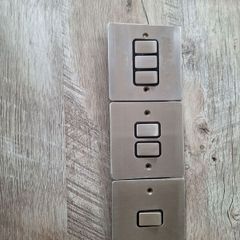 chrome electrical swithes and a single socket plate